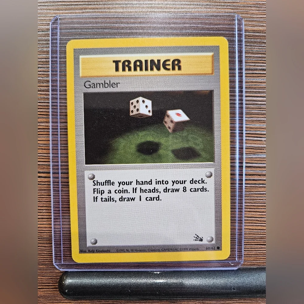 gambler pokemon card Trainer 60/62 Fossil Set TCG In Protective Penny  The Game Experts Mint / near mint condition trading card Gambler (60/62) [Fossil 1st Edition]